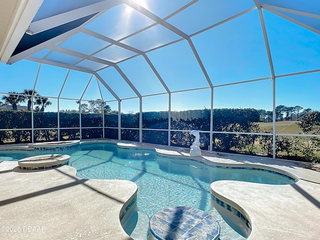 view of swimming pool with a lanai and a patio