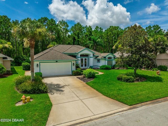 ranch-style home featuring a garage and a front lawn