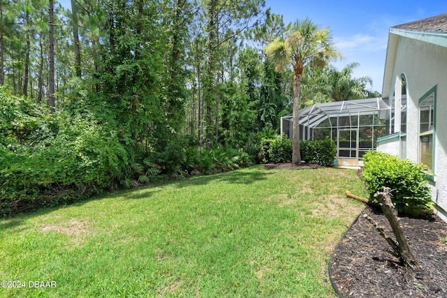 view of yard with a lanai