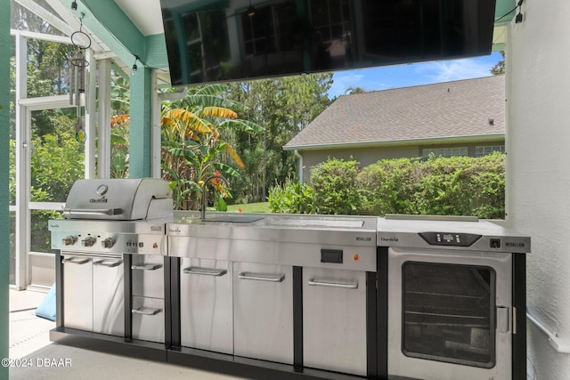 view of patio / terrace featuring exterior kitchen