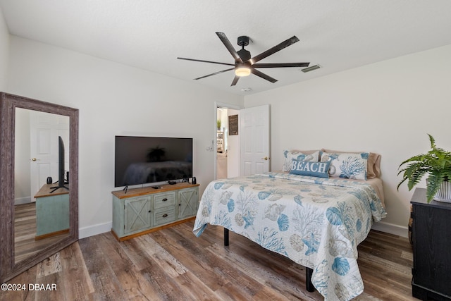 bedroom featuring ceiling fan and hardwood / wood-style floors