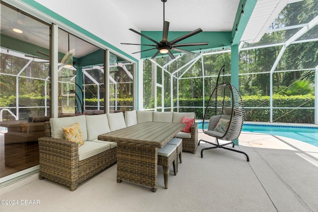 sunroom with a swimming pool, a wealth of natural light, and vaulted ceiling