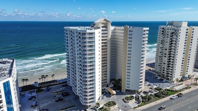 bird's eye view with a water view and a view of the beach