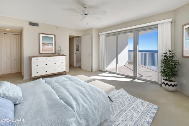 bedroom with access to outside, light carpet, and ceiling fan