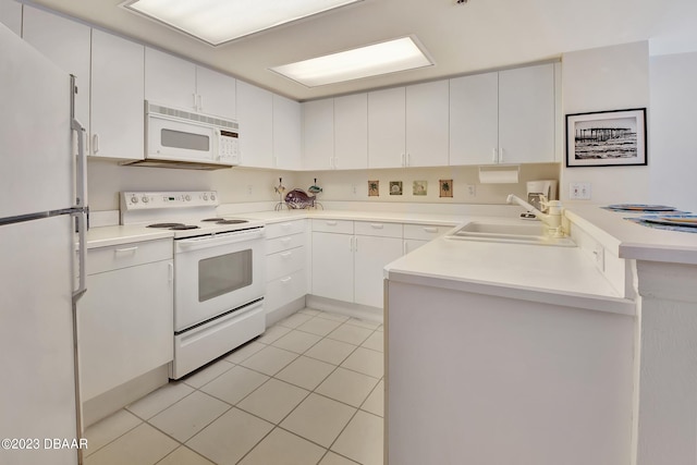 kitchen with white appliances, sink, light tile patterned flooring, and white cabinets