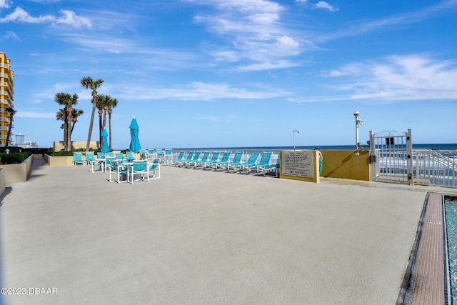 view of patio with a water view