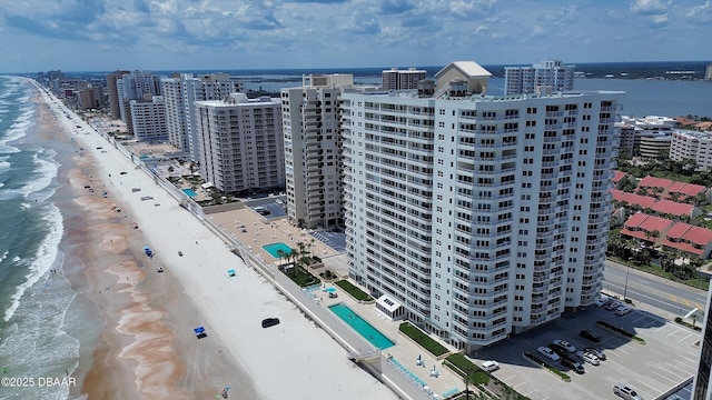 2937 S Atlantic Ave Unit 1108, Daytona Beach Shores, FL 32118 - drone / aerial view of extended coastline, a pool area, and apartment complex