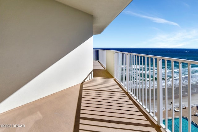 balcony with a view of the beach and a water view