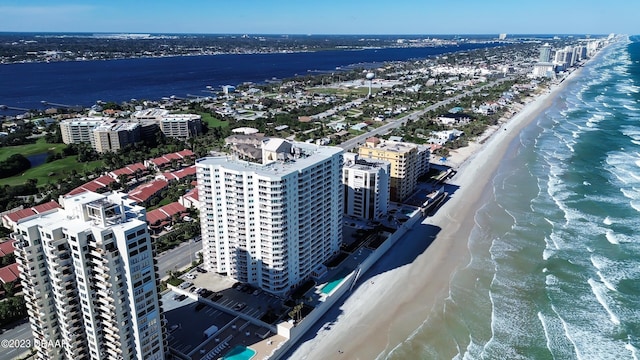 bird's eye view featuring a view of the beach and a water view