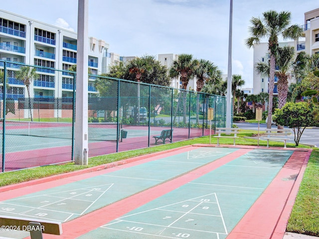 surrounding community with tennis court