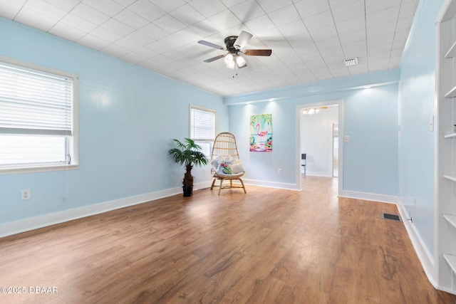 unfurnished room featuring hardwood / wood-style floors and ceiling fan