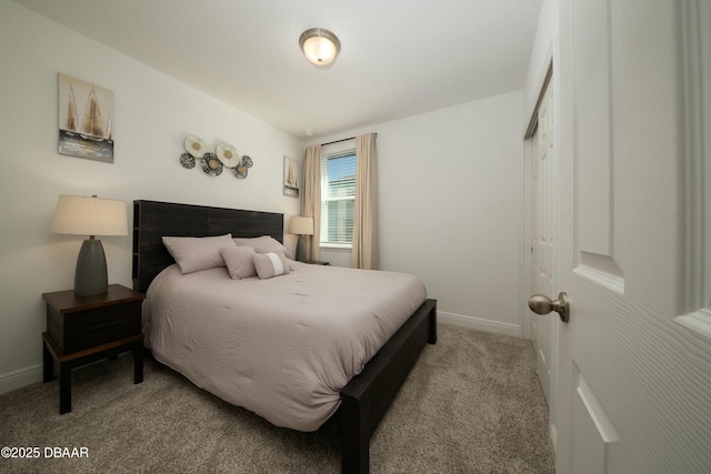 carpeted bedroom with baseboards