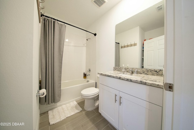 full bathroom featuring toilet, shower / bath combo with shower curtain, vanity, and visible vents