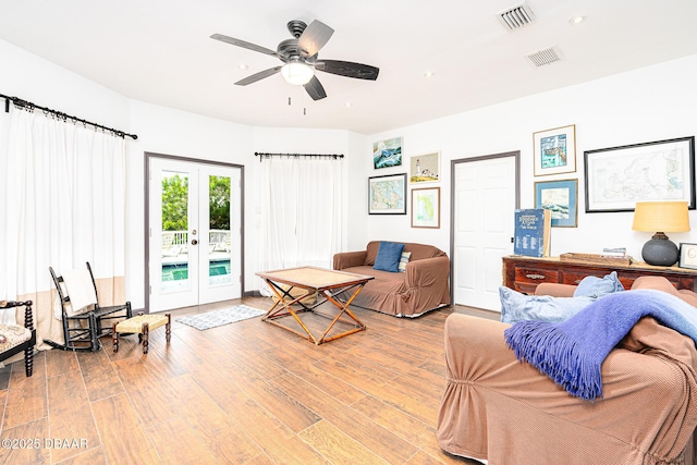 3110 John Anderson Dr, Ormond Beach, FL 32176 - living room with ceiling fan, light wood-type flooring, and french doors