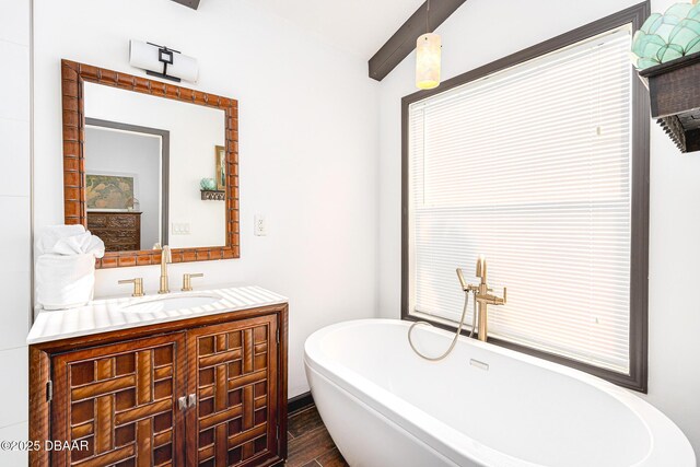 3110 John Anderson Dr, Ormond Beach, FL 32176 - bathroom featuring hardwood / wood-style flooring, vanity, and a tub
