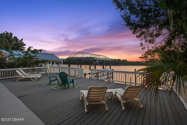 3110 John Anderson Dr, Ormond Beach, FL 32176 - deck at dusk with a gazebo and a water view