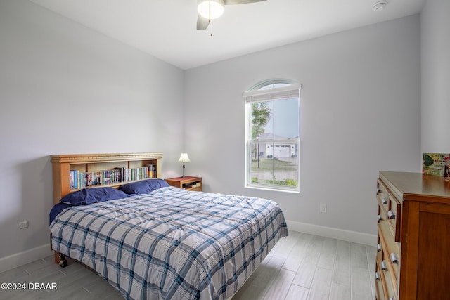 bedroom featuring light wood-type flooring and ceiling fan