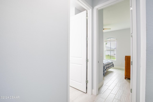 hall with light hardwood / wood-style floors