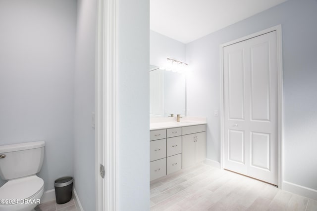 bathroom with toilet and vanity