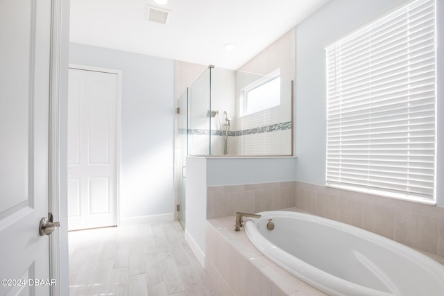 bathroom with independent shower and bath