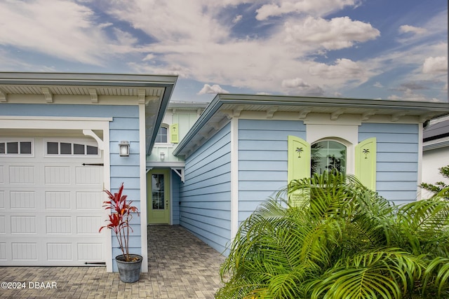 view of side of home featuring a garage