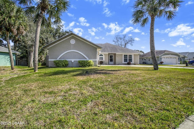 single story home with a garage and a front lawn