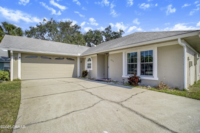 ranch-style home featuring a garage