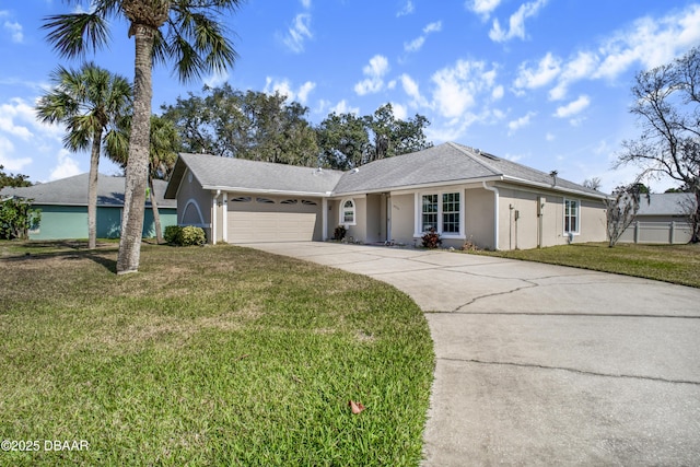 ranch-style home featuring a garage and a front lawn