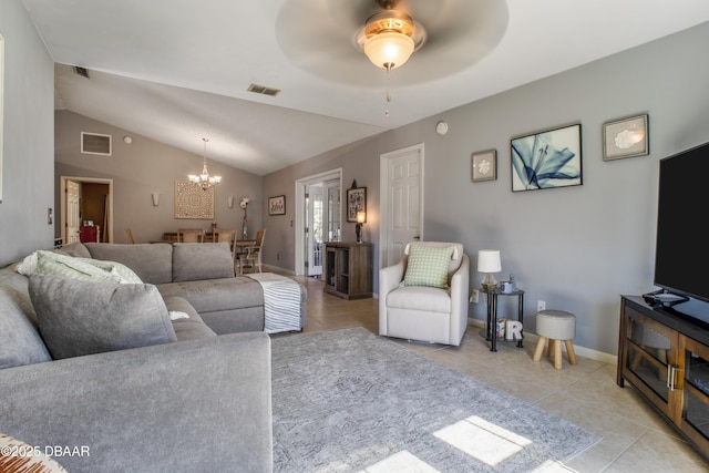 tiled living room with vaulted ceiling and ceiling fan with notable chandelier