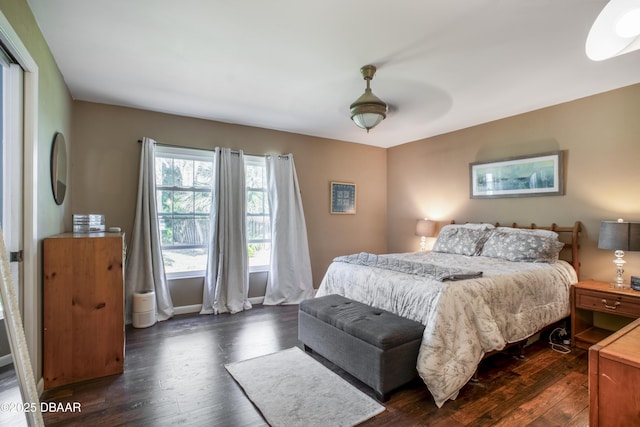 bedroom featuring dark wood-type flooring and ceiling fan