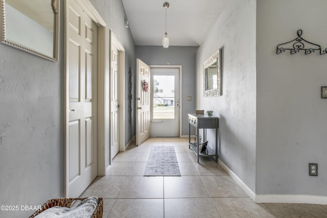 entryway featuring light tile patterned flooring