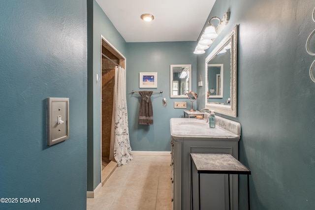 bathroom with vanity, tile patterned flooring, and walk in shower