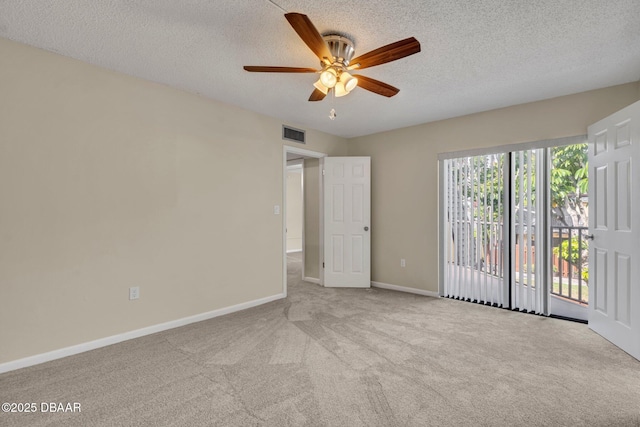3824 Saxon Dr, New Smyrna Beach, FL 32169 - carpeted empty room featuring a ceiling fan and a textured ceiling