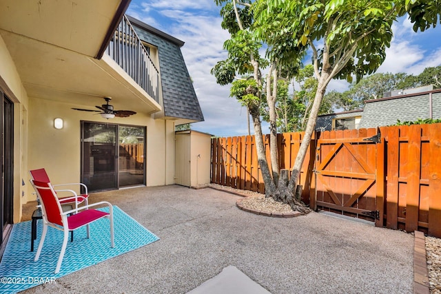 3824 Saxon Dr, New Smyrna Beach, FL 32169 - view of patio / terrace featuring a gate and ceiling fan