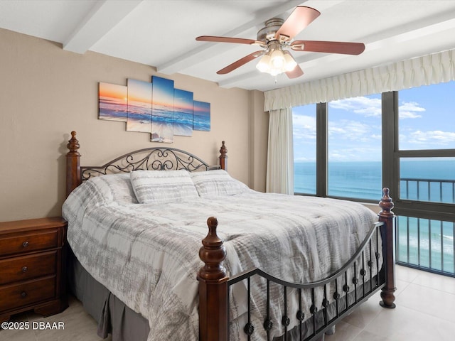 bedroom with beam ceiling, ceiling fan, and a water view