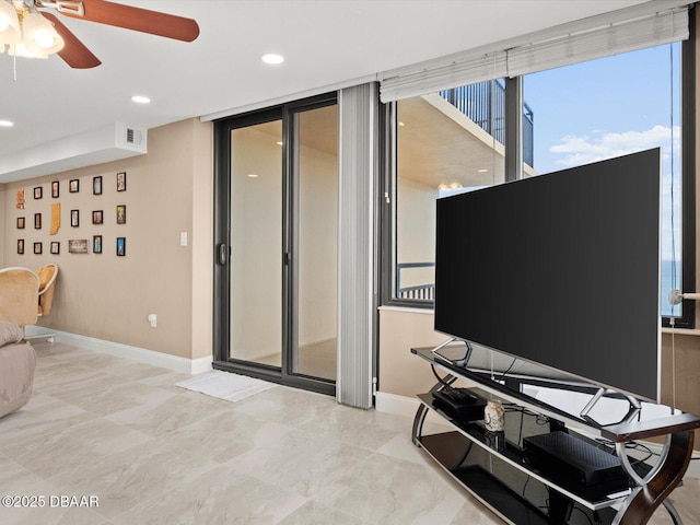 living room with ceiling fan