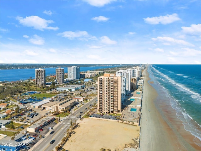 bird's eye view featuring a beach view and a water view