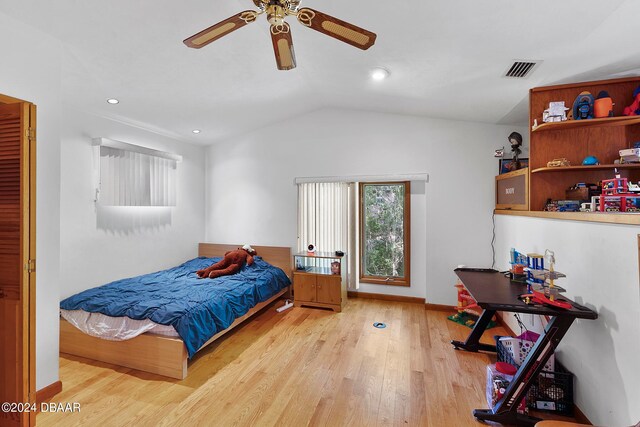 bedroom featuring vaulted ceiling, ceiling fan, and light hardwood / wood-style flooring