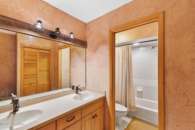 full bathroom featuring toilet, vanity, shower / bath combination with curtain, and tile patterned flooring