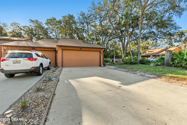 view of side of property featuring a garage