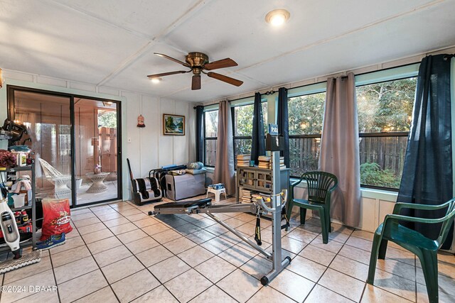 sunroom featuring ceiling fan