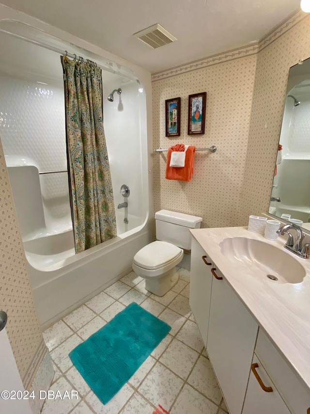 full bathroom featuring vanity, tile patterned flooring, toilet, and shower / bath combination with curtain