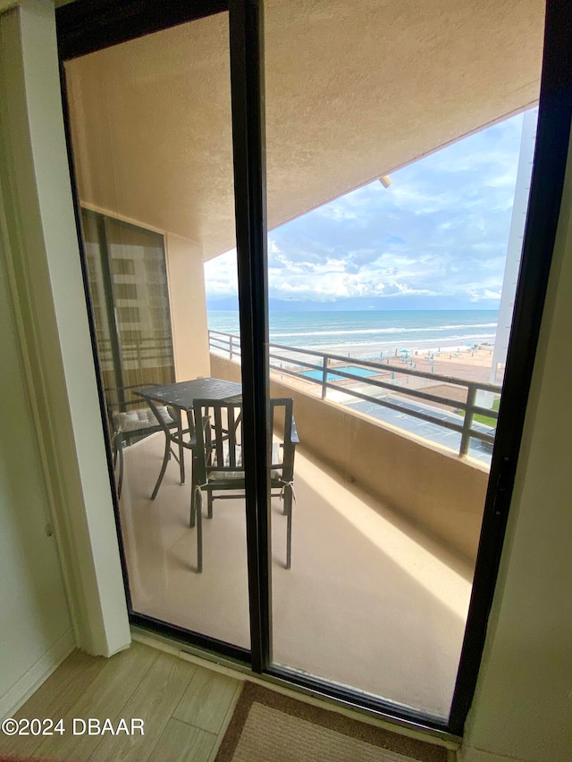 balcony with a view of the beach and a water view