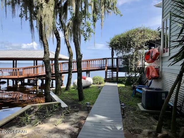 21951 Tarragona Way, Astor, FL 32102 - dock area featuring a water view and central air condition unit