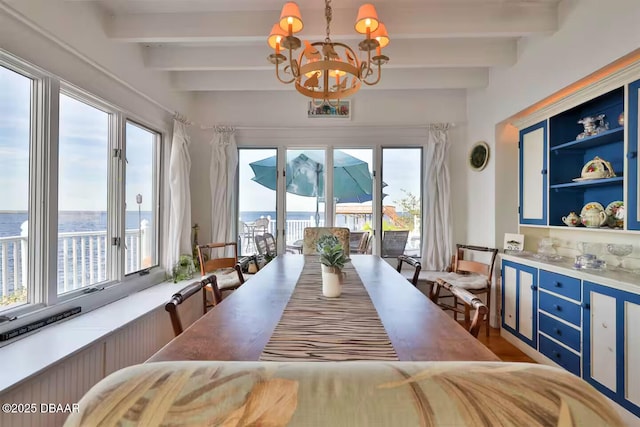 21951 Tarragona Way, Astor, FL 32102 - dining room with a chandelier and beamed ceiling