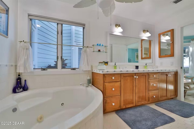21951 Tarragona Way, Astor, FL 32102 - full bath featuring vanity, a whirlpool tub, and a ceiling fan
