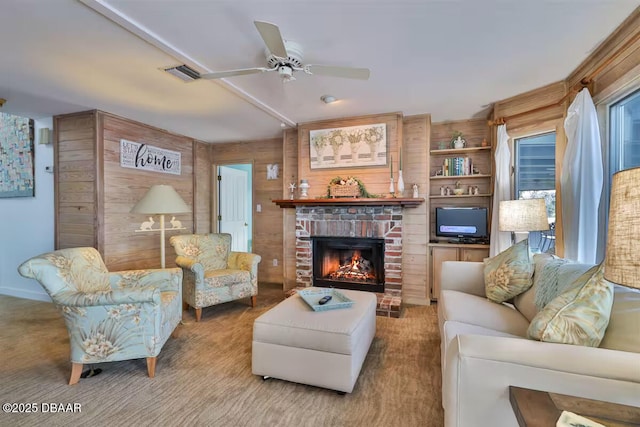 21951 Tarragona Way, Astor, FL 32102 - carpeted living room featuring a brick fireplace, ceiling fan, and wooden walls