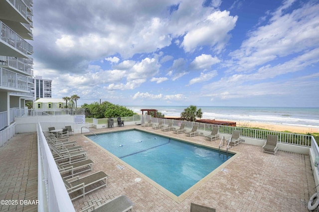 1183 Ocean Shore Blvd Unit 602, Ormond Beach, FL 32176 - community pool with view of water and beach and a patio area