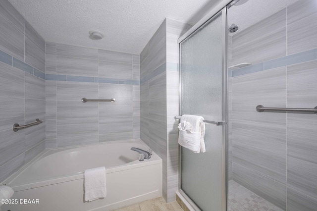 1183 Ocean Shore Blvd Unit 602, Ormond Beach, FL 32176 - full bath with a bath, tiled shower, a textured ceiling, and tile patterned flooring
