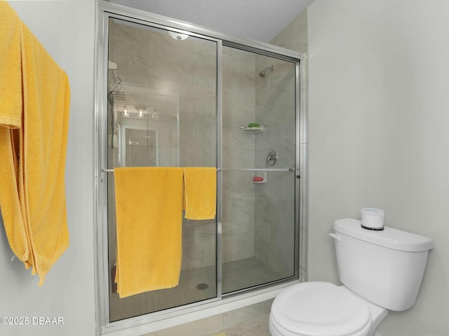 bathroom with toilet and walk in shower